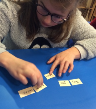 Millie creating a sentence